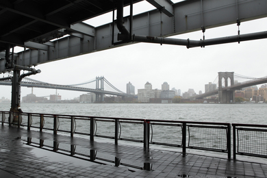 View of New York City’s East River rising during Hurricane Sandy. The Brooklyn and George Washington Bridges are in background.