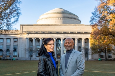 Dinah Sah and Cardinal Warde stand in front of the dome of Building 10 at MIT. 