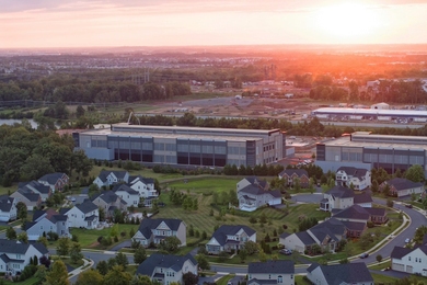 Aerial sunset photo of a data center in a suburban neighborhood