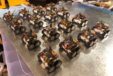 Sixteen tiny four-wheeled rovers in four by four array