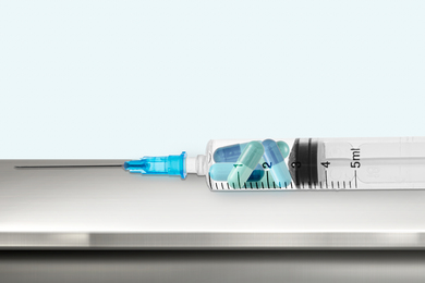 Syringe filled with various medicinal capsules