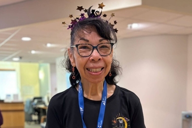 Juanita Battle at MIT Health with a Halloween-style headband 