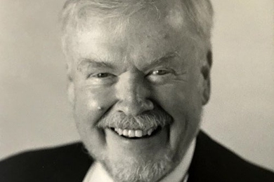 A grayscale portrait photo of Victor McElheny