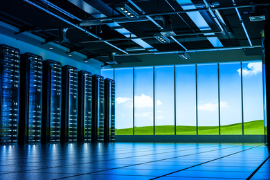 A data center overlooking a green, sunny landscape