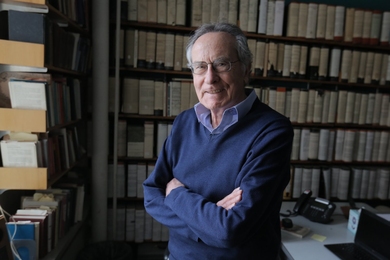 Portrait photo of Ioannis Yannas in front of a bookcase