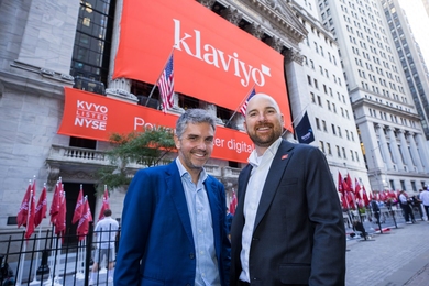 Andrew Bialecki and Ed Hallen pose outside the New York Stock Exchange