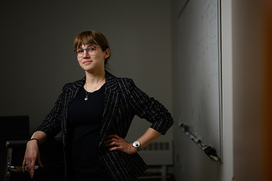 Sophia Henneberg in a room with a whiteboard with writing on the right