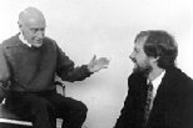 Professor George Pratt (left) demonstrates the sonometer, a device he invented to measure bone density, with Kevin Wilson (Ph.D '85), who works for Hologics, the company manufacturing the device.