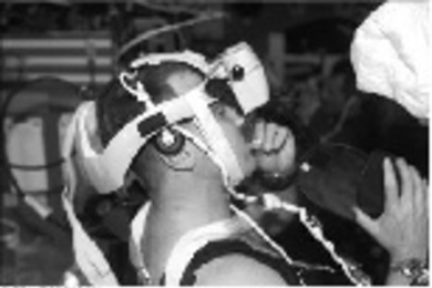 Canadian mission specialist Dave Williams performs MIT's spatial-orientation experiment on the shuttle last week while free-floating and wearing the Virtual Environment Generator display.