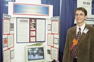 Geoffrey Schmidt with the exhibit for his prize-winning project at the Intel International Science and Engineering Fair.