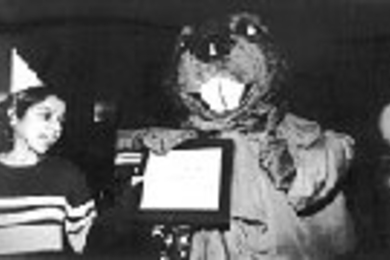 Farheen Qadir, a senior in chemical engineering, helped the MIT Beaver celebrate his 85th birthday last week. Among his many gifts was a a certificate he's holding for a full check-up and cleaning at MIT Dental.