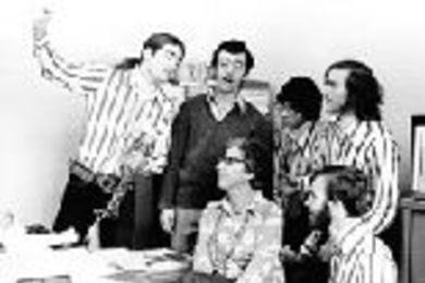 The Logs serenade Julie McLellan, then associate director of admissions, in this mid-1970s photo.