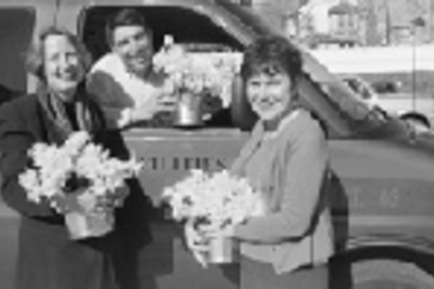 Getting ready to deliver daffodils are (left to right) Janet Plotkin, service project vice president of the MIT Women's League and coordinator of Daffodil Days; Rui Borges, operations supervisor coach; and Penny Guyer, manager of mail services.