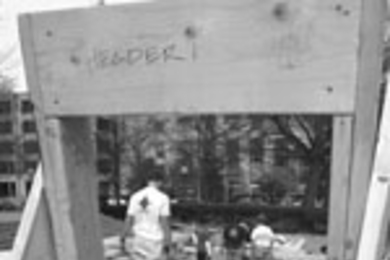 Students and staff volunteering for Habitat for Humanity built frames next to the Student Center for houses that will eventually appear in Roxbury and elsewhere.