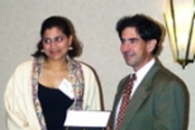 Sophomore Sumita Pennathur receives the James Means Memorial Award for Excellence in Space Systems Engineering from Professor Edward Crawley, head of the Department of Aeronautics and Astronautics.