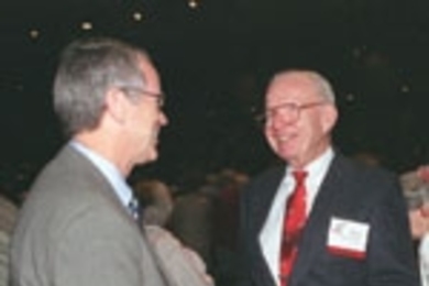 President Charles Vest (left) talks with Norman B. Duffet (SB 1940) in between Tech Day speakers in Kresge Auditorium.