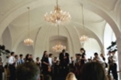 Conductor Dante Anzolini acknowledges the audience's applause after the MIT Symphony Orchestra's performance in the famed Orangerie of Vienna's Schoenbrunn Palace. Both Mozart and Beethoven performed in the Orangerie.