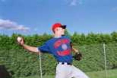 Jason Szuminski, Class of 2000, displays his pitching prowess while wearing a Chicago Cubs T-shirt. The aero/astro major was drafted by the major-league baseball team, but owes time to the Air Force because of his ROTC scholarship.