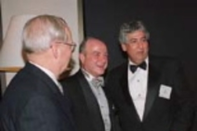 President Emeritus Howard Johnson (left), alumnus Kenan Sahin (center) and Dean Philip Khoury of the School of Humanities, Arts, and Social Sciences share a laugh at the school's 50th anniversary gala.