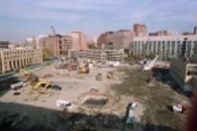 The space vacated by Building 20 for the future Stata Center, as seen from atop Building 26, is just one of several construction sites around campus.
