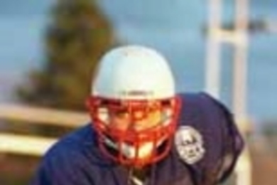 Officer Theresa Gomes in uniform for her off-duty role -- as a linebacker.