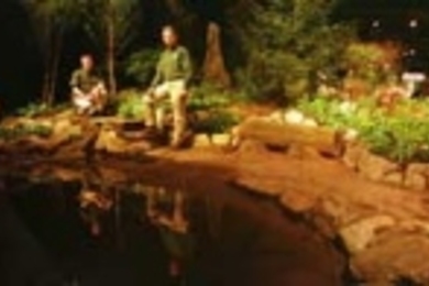 Endicott House horticulturist Steve Wiswell (left) and Grounds Department head Andy Turcotte stand in the garden exhibit they created at the New England Spring Flower Show to exemplify the original rock garden from early 19th-century Endicott House. The exhibit won six awards and a gold medal.
