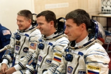 The ISS Expedition 1 crew prior to launch from the Baikonur Cosmodrome. Left to right: crew commander William Shepherd, Yuri Gidzenko and Sergei Krikalev.
