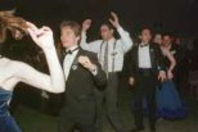 Dancers form a conga line at last weekend's Odyssey Ball.