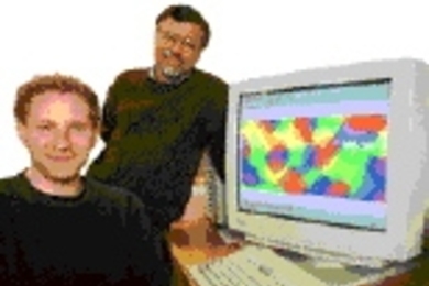 Valentin Drago, left, and Mriganka Sur with a map of cells in the primary visual cortex that "see" tilted line segments.