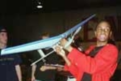 Tarik Ward, a sophomore in aeronautics and astronautics, shows off his entry in Unified Engineering's aerial contest.