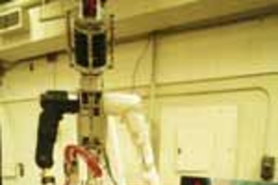 Professor Dava J. Newman shows the degree of mobility in the space suit she and colleagues designed and which they hope will be used in a future mission to Mars. Current space suits have feet that simply lock into place, but those in the next-generation suit will need to be able to move around more freely.