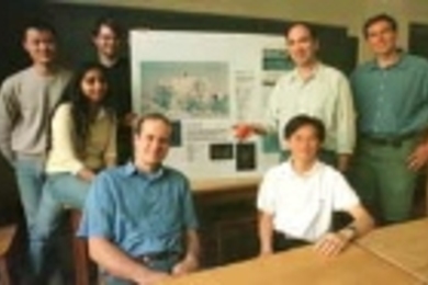 Professor Nicholas Makris (second from right, standing) holds an acoustic sensor that his lab is developing. His research group hopes the sensor will help scientists learn whether there is a liquid ocean under the ice of Jupiter's moon Europa. The group includes (left to right) Sunwoong Lee, Purnima Ratilal, Josh Wilson, Michele Zanolin and Yi-San Lai (both seated at table), and Aaron Thode (far r...