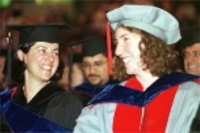Beaming at the doctoral hooding ceremony are Valeria Koukoutsi-Mazarakis (left) and Juliet Koss, who received PhDs in the history and theory of architecture.