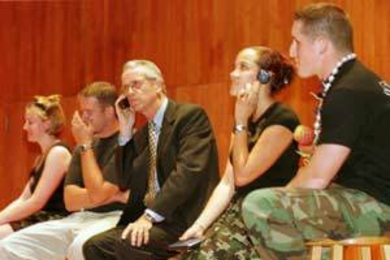 Participants in the "Survivor" spoof at convocation, from left, junior Trisha McAndrew, staff associate Dan Chapman, President Charles M. Vest, senior Roxanne Cartwright, and junior Michael Ramos.
