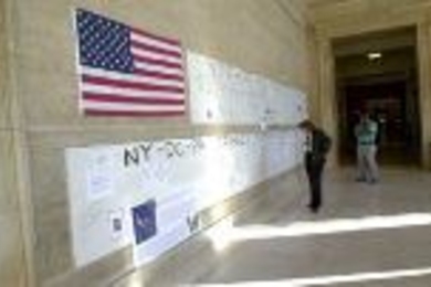 Community members wrote their thoughts on banners hung in Lobby 10 after last week's terrorist attacks.