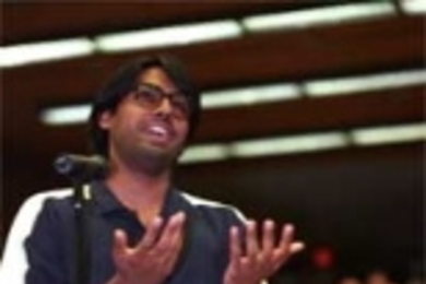 Mechanical engineering graduate student Arvind Narayanaswamy (left) addresses the panel at the first of a series of teach-ins organized by the School of Humanities, Arts and Social Sciences in response to the terrorist attacks.