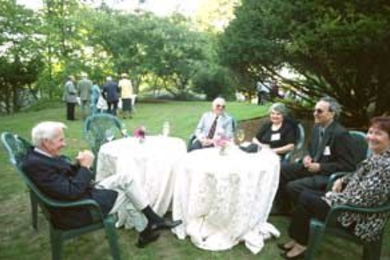Thomas Cosgrove (far left), Vincent Orlando, Joanne Orlando, Angelo Colao and Gabriele Colao enjoyed the gardens at Endicott house during the retirement party on Sept. 5.