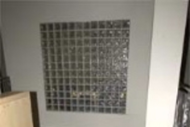 Christina Silcox (left) stands with housemasters Steven and Lori Lerman in the new 224 Albany St. residence, which Silcox says already has a sense of community.