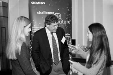 Winning team members Dora Sosnowik (left) and Shira Billet, both seniors at Stella K. Abraham High School for Girls in Hewlett Bay Park, N.Y., chat with keynote speaker Eric Lander, director of the Whitehead Institute's Center for Genome Research and professor of biology, at the New England regional Siemens Westinghouse Science &amp; Technology Competition. Sosnowik and Billet developed a precise ...