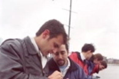 Trying out the new ENVIT system on the Massachusetts Avenue bridge are (left to right) graduate students Richard Camilli, Enrique Vivoni (lowering a line into the river to retrieve a water sample) and Ching-Huei Tsou; senior Amy Watson; and graduate student Russ Spieler.