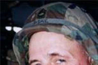 MIT Director of Safety Programs Jerry Diaz, a registered nurse and a master sergeant in the Army, in a Black Hawk helicopter in Kosovo.