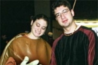 Lisa Katz, program coordinator at Hillel, is dressed as a bagel at Hillel's popular bagel tasting event.  She is joined by Even Schultz, JSC fellow at Hillel.