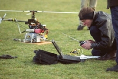 Vladislav Gavrilets, an aeronautics and astronautics doctoral student, prepares to launch the robocopter in its early-morning flight Monday.