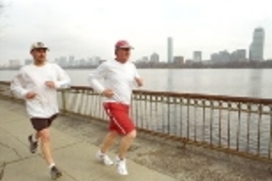Brian Foti (left) and David Barber, staff members in Facilities, train for        the marathon with a 16-mile run.
