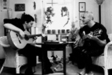 Niï¿½o de Pantalï¿½on (left) and Josï¿½ F. A. Oliver practice their unique hybrid of music and poetry.