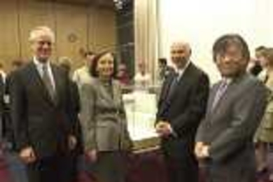 President Charles M. Vest, Barbara Picower, Jeffry Picower and Professor Susumu Tonegawa at last week's announcement of the Picower Foundation's gift of $50 million to establish the Picower Center for Learning and Memory at MIT. An architect's early design model for the new center can be seen on the table behind them.