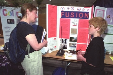 Parent Lise Foss talks with Jonathan Ottinger, a student at the Longfellow School.