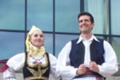 Tania Nouchev and Djordje (George) Koldzic display their Serbian finery during the fashion show at last month's International Fair. Similar costumes will be seen at Saturday's performance of Serbian and Balkan music and dance in Kresge.