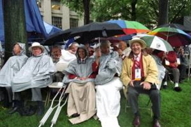 Members of the Class of 1952 who braved the rain for their 50th reunion        included Richard Daly (center, with crutches next to him), Benjamin Boley (to Daly's left) and Arnold Kramer (in the yellow jacket).