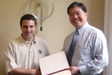 Associate Dean of Engineering Dick Yue (right) congratulates the Henry Ford Award recipient, Ian Parrish